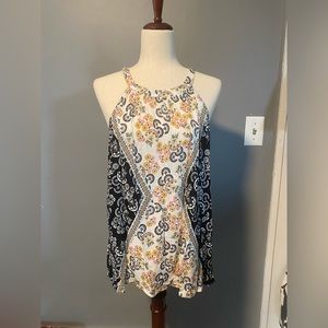 Cute Floral Sleeveless Blouse perfect for a Casual Summer Brunch!